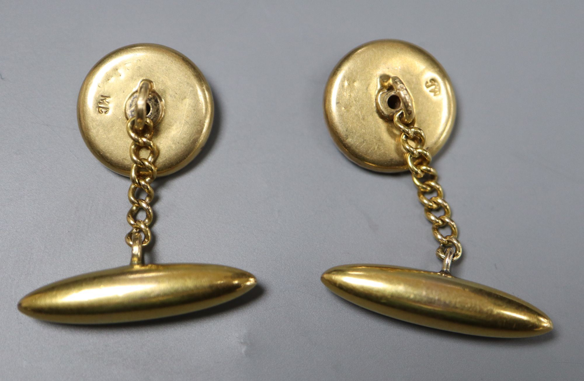 A pair of early-mid 20th century French? yellow metal, guilloche enamel and diamond set circular cufflinks,